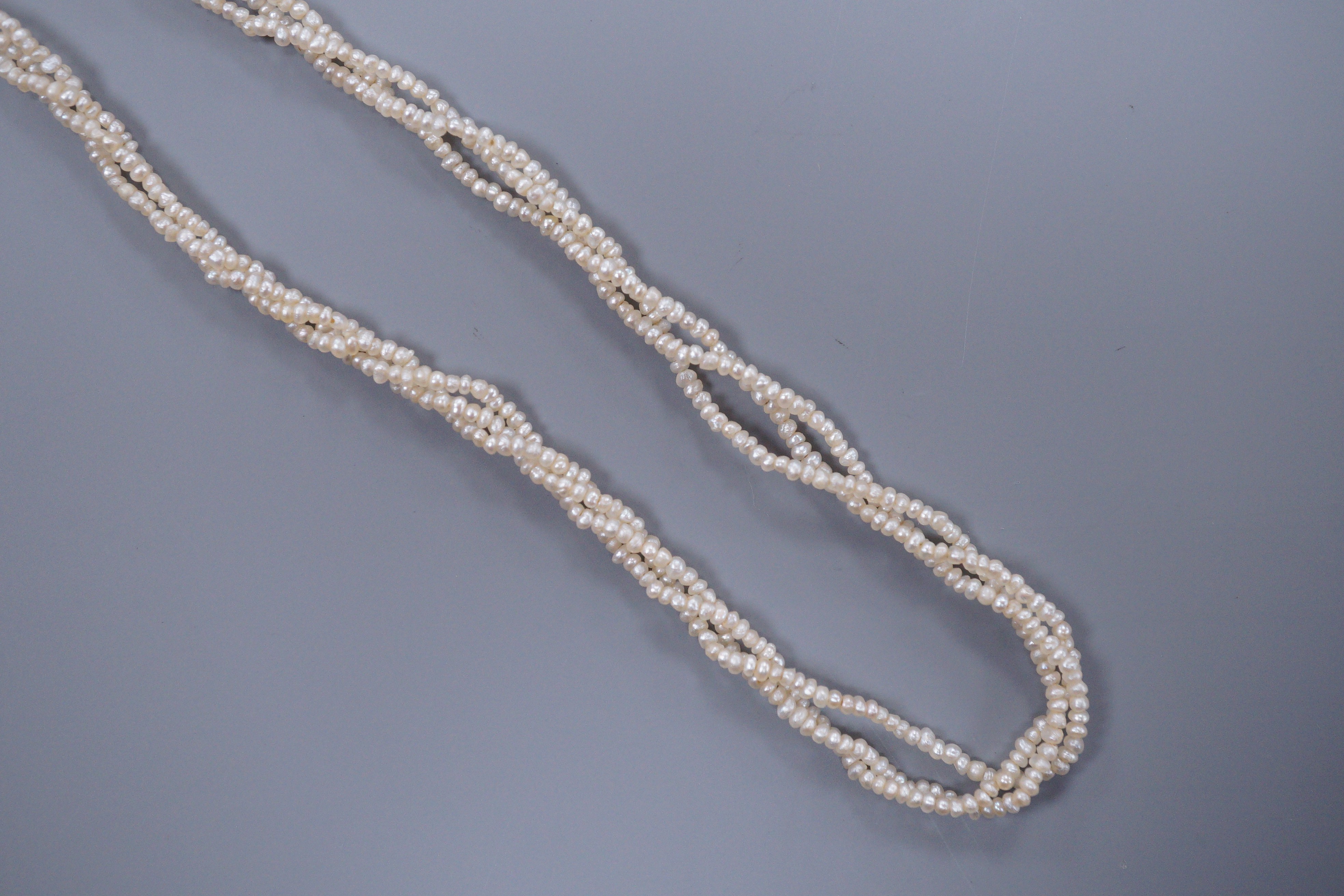 A Victorian triple strand seed pearl necklace, with gold clasp, 42cm